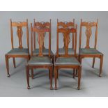 A set of 6 Edwardian Art Nouveau oak slat back dining chairs with upholstered drop in seats,