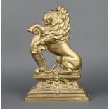 A Victorian gilt painted cast iron doorstop in the form of a rampant lion 37cm h x 25cm w x 7cm d