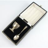 A silver egg, cup and spoon, cased Birmingham 1962, 38 grams