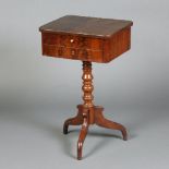 A 19th Century Continental walnut work box fitted 2 long drawers, raised on turned column and tripod