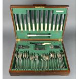 An Art Deco mahogany canteen containing a set of Old English plated cutlery for 6, 46 pieces (ex 49)