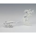 A Swarovski Crystal figure of a shark 12cm, another of a group of fish 11cm, boxed