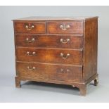 An 18th Century oak chest of 2 short and 3 long drawers with brass swan neck drop handles, raised on