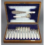 A cased set of silver and mother of pearl fish eaters and servers for 6, Sheffield 1930, contained