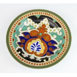 A Gouda Pottery Paola Royal plate decorated with scrolls 29cm