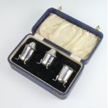 A cased silver plated 3 piece condiment