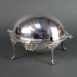 A silver plated breakfast server raised on splayed legs and retracting cover