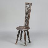 A Victorian carved oak spinning chair with lozenge shaped seat, raised on turned supports 82cm h x