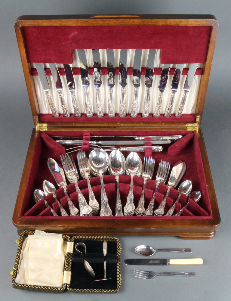 A mahogany canteen containing a set of kings pattern cutlery for 6 and minor plated cutlery