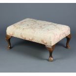 A Queen Anne style footstool with overstuffed seat, raised on cabriole supports 34cm h x 77cm w x