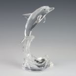 A Swarovski Crystal figure from The Silver Crystal Collection of a dolphin on a wave 20cm, boxed