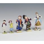 A pair of German porcelain figures of street urchins raised on square bases 11cm (both chipped), a