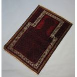 A red and blue ground Belouche prayer rug 128cm x 88cm