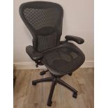 AN AERON SWIVERL OFFICE CHAIR, BY CHARLES AND RAY EAMES