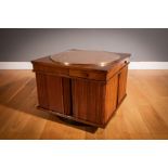 A WALNUT REVOLVING BAR, ITALIAN 1960s, BY GIANFRANCO FRATTINI