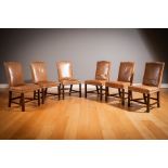 A SET OF SIX TANNED LEATHER UPHOLSTERED HUMPBACK DINING CHAIRS