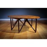 A FINE ROSEWOOD OVAL DROP LEAF DINING TABLE, DANIS