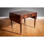 A MAHOGANY DROP LEAF TABLE