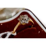 AN 18CT YELLOW GOLD DIAMOND FLOWER HEAD RING, size L, approximately 3 grams.