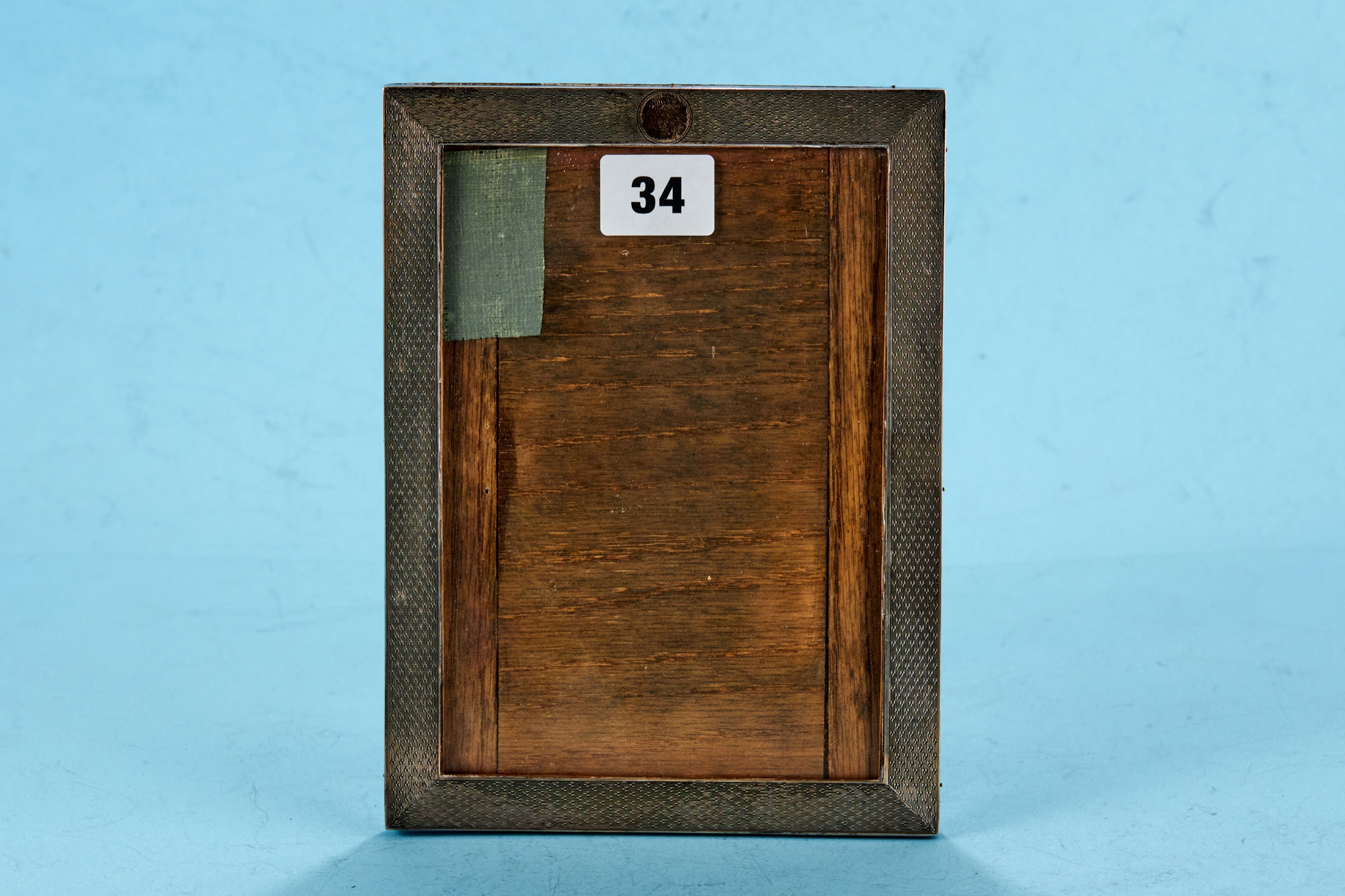 A GEORGE V RECTANGULAR SILVER ENGINE TURNED PHOTOGRAPH FRAME oak backed (lacks strut), maker: PJF,