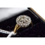 A LADY'S 18CT YELLOW GOLD RING with central diamond and diamond surround, stamped 18ct, mark rubbed,