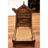 A 20TH CENTURY AFRICAN BRASS MOUNTED TENT CHAIR, with woven seat raised on short turned legs.