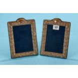 A PAIR OF ELIZABETH II FOLIATE EMBOSSED PHOTO FRAMES of arched rectangular form, maker: RC, 1993,
