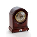 AN EARLY 20TH CENTURY MAHOGANY CASED MANTLEL CLOCK, silvered dial supporting a twin train French
