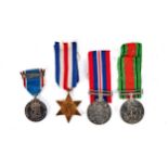 A 1939-45 DEFENCE MEDAL AND WAR MEDAL with ribbons, a George VI France and Germany bronze STAR and a