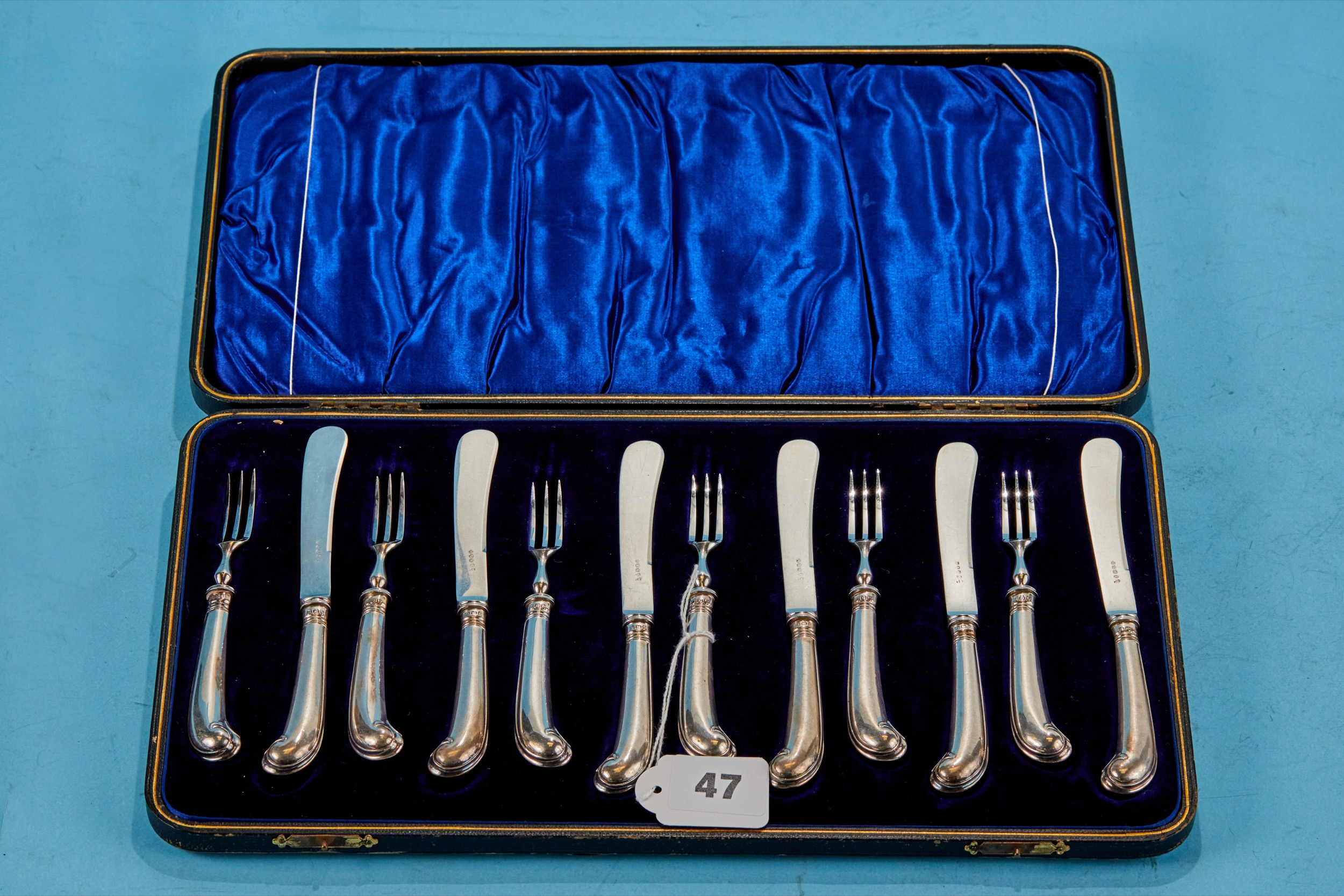 A SET OF SIX LATE VICTORIAN SILVER PISTOL-HANDLED TEA KNIVES AND FORKS, plated blades, maker GH,