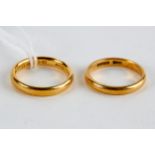 A 22CT YELLOW GOLD WEDDING BAND and a similar 22ct gold DITTO, approximately 10 grams. (2)