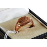 A GENTS ROSE GOLD SIGNET RING, engraved JBH initials, marks rubbed, approximately 5.2 grams.