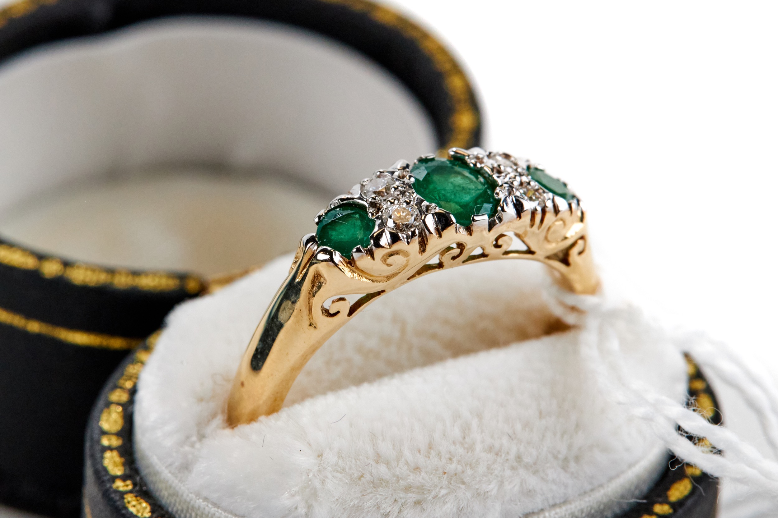 A LADY'S 9CT YELLOW GOLD EDWARDIAN STYLE EMERALD AND DIAMOND RING, size P, approximately 3.4 grams.