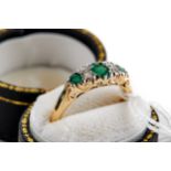 A LADY'S 9CT YELLOW GOLD EDWARDIAN STYLE EMERALD AND DIAMOND RING, size P, approximately 3.4 grams.