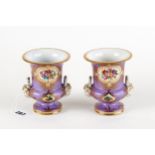 A PAIR OF 19TH CENTURY PORCELAIN CAMPANA SHAPED VASES, mauve ground with panels of hand painted
