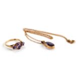 A LADY'S 9CT YELLOW GOLD THREE STONE AMETHYST RING, size O and an oval amethyst set PENDANT (no