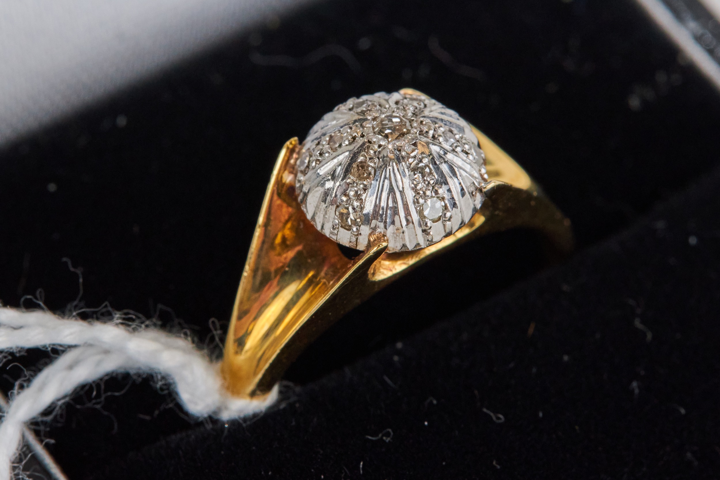 AN 18CT YELLOW GOLD DOME HEADED RING set with a star design in diamonds, size P, approximately 4.8