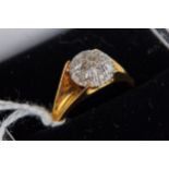 AN 18CT YELLOW GOLD DOME HEADED RING set with a star design in diamonds, size P, approximately 4.8