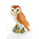A BESWICK POTTERY MODEL OF AN OWL, No 1046, approximately 7 1/2 ins high.