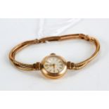 A LADY'S 9CT YELLOW GOLD BENTINA WRISTLET WATCH on a 9ct gold double flexible link strap.