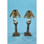 A PAIR OF EDWARDIAN SILVER PLATED CORINTHIAN COLUMN CANDLESTICKS raised on stepped square bases, 6