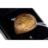 A GENTS GOLD 1982 HALF SOVEREIGN RING, 9ct gold mount, approximately 9.4 grams, size W.