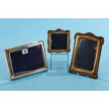 AN ELIZABETH II RECTANGULAR SILVER PHOTO FRAME with reeded border, maker: RC, stamped 925, 8 1/2 ins