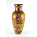 A LARGE LATE 19TH CENTURY JAPANESE EARTHENWARE VASE, yellow ground with polychrome flowers and