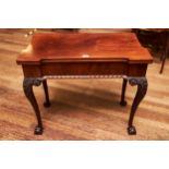 A GEORGE III MAHOGANY CHIPPENDALE STYLE FOLD OVER TOP CARD TABLE, inverted frieze with gadroon