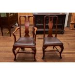 A SET OF SEVEN GEORGIAN REVIVAL MAHOGANY DINING CHAIRS with shaped splat backs, drop in seats raised