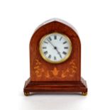 AN EDWARDIAN INLAID WALNUT LANCET-CASED MANTLE CLOCK, circular enamel dial with platform escapement,