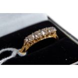 A LADY'S 18CT YELLOW GOLD AND PLATINUM FIVE STONE GRADUATED DIAMOND RING, stamped 18ct, plat, size