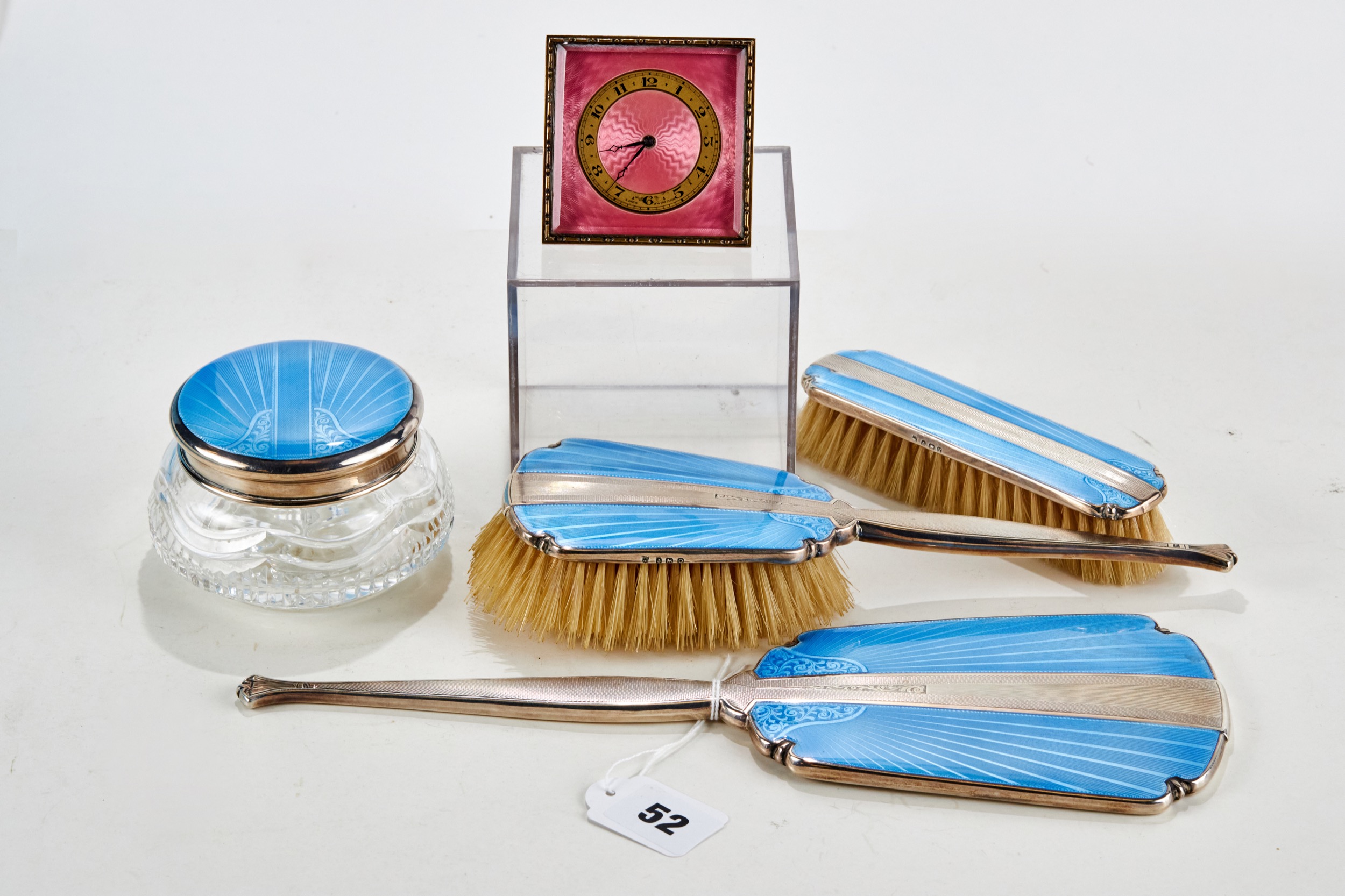 A GEORGE V SILVER AND BLUE GUILLOCHE ENAMEL DRESSING TABLE SET comprising hand mirror, jar and