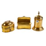 A 19TH CENTURY CYLINDRICAL WEIGHTED BASE BRASS TOBACCO JAR AND COVER with flame finial, 9 1/4 ins